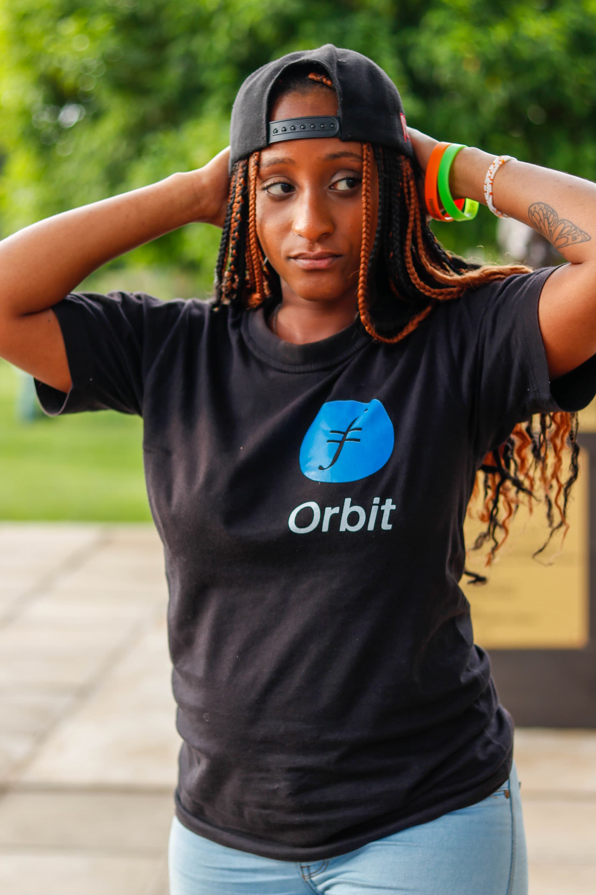 Woman wearing Filecoin Orbit shirt